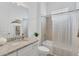 Bathroom featuring a shower and tub combination and a vanity with granite countertop at 25186 Keygrass Ct, Punta Gorda, FL 33955