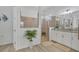 Modern bathroom featuring dual vanities and a glass-enclosed shower at 25186 Keygrass Ct, Punta Gorda, FL 33955