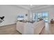 Bright living room with tile flooring, comfortable seating, and sliding glass doors at 25186 Keygrass Ct, Punta Gorda, FL 33955