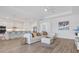 Spacious living room featuring an open floor plan and neutral color palette at 25186 Keygrass Ct, Punta Gorda, FL 33955
