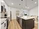 Spacious kitchen island with quartz countertops and pendant lighting at 25322 Durango Ct, Punta Gorda, FL 33955