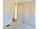 Comfortable bedroom with neutral walls, a closet, and carpeted flooring at 258 Palm Harbor Dr, North Port, FL 34287
