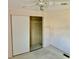 Neutral bedroom with sliding closet doors, a ceiling fan, and wall-to-wall carpeting at 258 Palm Harbor Dr, North Port, FL 34287