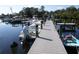 Dock with multiple boat slips providing convenient access to waterways at 258 Palm Harbor Dr, North Port, FL 34287