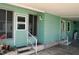 Carport entrance with adjacent doors and stairs, offering convenient access to the home at 258 Palm Harbor Dr, North Port, FL 34287