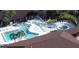 Aerial view of a community pool with sun loungers and a spa at 258 Palm Harbor Dr, North Port, FL 34287