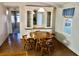 Comfortable dining room featuring wood floors, a classic table, and decorative hutch at 258 Palm Harbor Dr, North Port, FL 34287