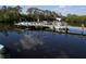Waterfront home featuring a private boat dock, perfect for boating and enjoying scenic water views at 258 Palm Harbor Dr, North Port, FL 34287