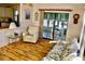 Living room showcasing wood floors and direct access to the screened in porch at 258 Palm Harbor Dr, North Port, FL 34287
