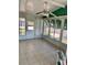 The spacious screened in porch has tile floors and plenty of natural light at 258 Palm Harbor Dr, North Port, FL 34287