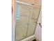 Bathroom shower featuring glass doors and metal trim at 258 Palm Harbor Dr, North Port, FL 34287