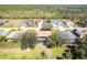 An overhead shot of the backyard and the community beyond the screened-in patio at 27199 Punta Cabello Ct, Punta Gorda, FL 33983