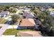 Aerial view of a single-story home featuring a screened-in patio and well-maintained landscaping at 27199 Punta Cabello Ct, Punta Gorda, FL 33983