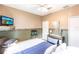 Inviting bedroom featuring a ceiling fan and large window with natural light at 27199 Punta Cabello Ct, Punta Gorda, FL 33983