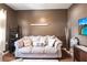 Relaxing living room provides a cozy sofa, neutral colors, and decor creating a comfortable atmosphere at 27199 Punta Cabello Ct, Punta Gorda, FL 33983