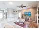 The living room has recessed lighting, tile flooring and a ceiling fan at 27199 Punta Cabello Ct, Punta Gorda, FL 33983
