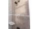 Tiled shower featuring modern fixtures and a convenient soap dish at 27199 Punta Cabello Ct, Punta Gorda, FL 33983