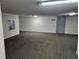 Spacious hallway with neutral carpeting, lighting, and easy access to units at 3006 Caring Way # 409, Port Charlotte, FL 33952