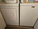Efficient laundry area featuring a modern washer and dryer for convenient in-home laundry at 3006 Caring Way # 409, Port Charlotte, FL 33952