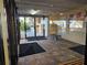 Welcoming lobby area with tile flooring and glass doors leading outside at 3006 Caring Way # 409, Port Charlotte, FL 33952