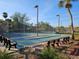 Enjoy leisurely afternoons at the shuffleboard courts surrounded by lush landscaping and swaying palm trees at 3006 Caring Way # 409, Port Charlotte, FL 33952