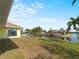 Large backyard with water access and lush landscaping at 3370 Dover Dr, Punta Gorda, FL 33983