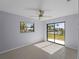 Bedroom with sliding door access to backyard at 3370 Dover Dr, Punta Gorda, FL 33983