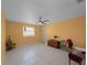 Spacious bedroom with tiled floors and ceiling fan at 3370 Dover Dr, Punta Gorda, FL 33983