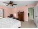 Main bedroom with tiled floors and large dresser at 3370 Dover Dr, Punta Gorda, FL 33983