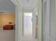 Hallway with light green walls and access to bedrooms and bathrooms at 3370 Dover Dr, Punta Gorda, FL 33983