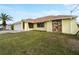 Charming yellow house with a stone accent wall at 3370 Dover Dr, Punta Gorda, FL 33983