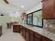 Kitchen with granite countertops, stainless steel appliances, and an island at 3370 Dover Dr, Punta Gorda, FL 33983