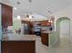 Kitchen with granite countertops, stainless steel appliances, and dark wood cabinets at 3370 Dover Dr, Punta Gorda, FL 33983