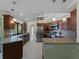 Open kitchen with granite countertops, an island, and a breakfast nook at 3370 Dover Dr, Punta Gorda, FL 33983