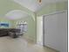 Living room with a sectional sofa, tiled floors, and large windows at 3370 Dover Dr, Punta Gorda, FL 33983