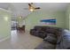 Living room with a large sectional sofa and light green walls at 3370 Dover Dr, Punta Gorda, FL 33983