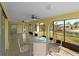 Large screened-in porch with canal views and outdoor seating at 3370 Dover Dr, Punta Gorda, FL 33983