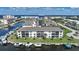 Waterfront condos with boat docks, lush landscaping, and scenic water views on a sunny day at 367 Coldeway Dr # H10, Punta Gorda, FL 33950