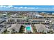 Real estate including waterfront condos overlooking a community pool with lounge seating at 367 Coldeway Dr # H10, Punta Gorda, FL 33950