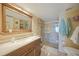 Bathroom featuring a tiled shower, ample counter space, and a modern design at 367 Coldeway Dr # H10, Punta Gorda, FL 33950