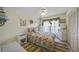 Colorful bedroom with patterned bedding and bright, light, airy decor at 367 Coldeway Dr # H10, Punta Gorda, FL 33950