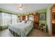Comfortable bedroom with spacious built-in storage and natural light from the window at 367 Coldeway Dr # H10, Punta Gorda, FL 33950