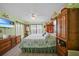 Spacious bedroom with a large window, TV, and ample storage at 367 Coldeway Dr # H10, Punta Gorda, FL 33950