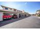 Carport with multiple parking spaces and various vehicles parked beneath the covered area at 367 Coldeway Dr # H10, Punta Gorda, FL 33950