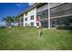 Beautiful lawn and landscaping around the building with the screened-in lanais at 367 Coldeway Dr # H10, Punta Gorda, FL 33950