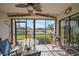 Covered lanai features a seating area with views of the water, boats, and beautiful landscaping at 367 Coldeway Dr # H10, Punta Gorda, FL 33950