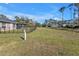 Expansive backyard with ample green space and a fence line at 4175 Horseshoe Ave, North Port, FL 34286