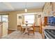 Bright breakfast nook with a built-in bench and a view of the backyard at 4175 Horseshoe Ave, North Port, FL 34286