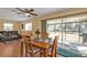 Bright dining room with access to the lanai and overlooking the backyard with ample natural light at 4175 Horseshoe Ave, North Port, FL 34286