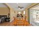 Cozy dining room leading to the living room and lanai with sliding glass doors at 4175 Horseshoe Ave, North Port, FL 34286